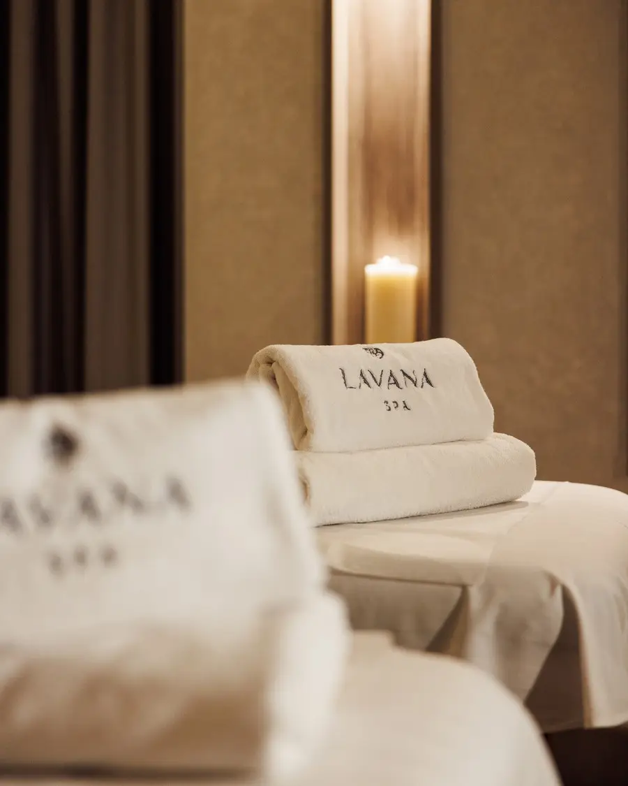 Two treatment beds side by side with folded Lavana Spa towels in the couples room at Lavana Spa DIFC